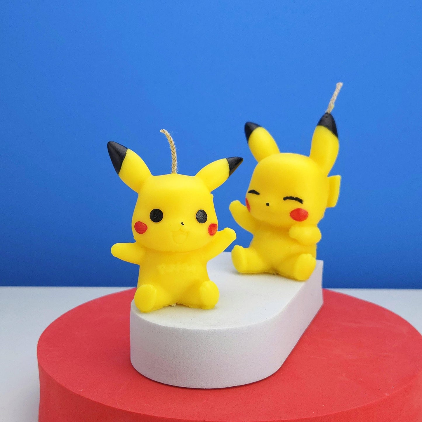 Pokémon candles display on the tables, yellow colored pikachu candle, red blusher face and yellow body brown flash tail, desk decor candles, scented candle pokemon, anime themed candle, pokemon fans love it, soy wax home decor, gift for best friends