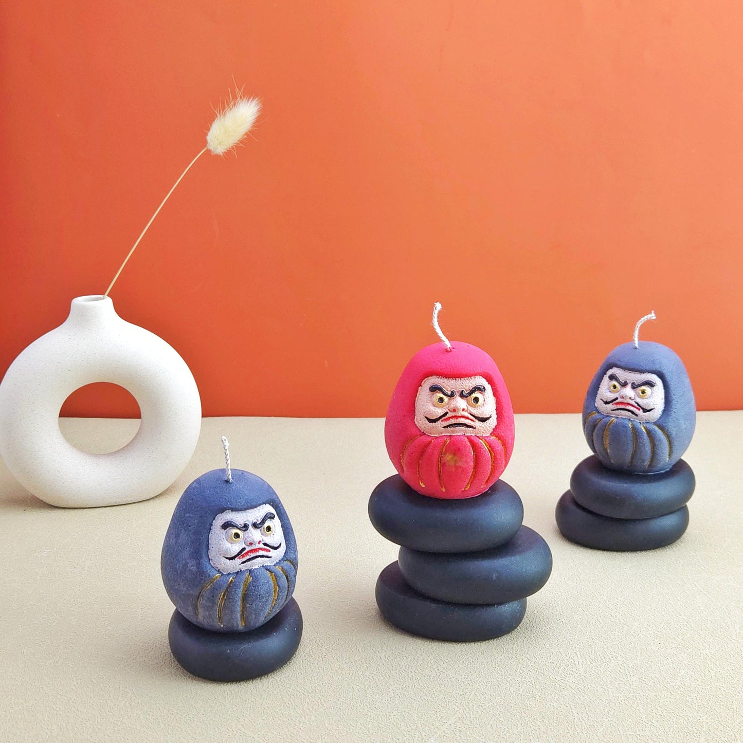 daruma doll, daruma candle, handmade candle, soy wax candle, pillar wax, good fortune candles, unique candle, lucky charm gifts, scented candle, cute candle, Japanese-style home decor, home decor, positive energy candles, inspirational gift ideals