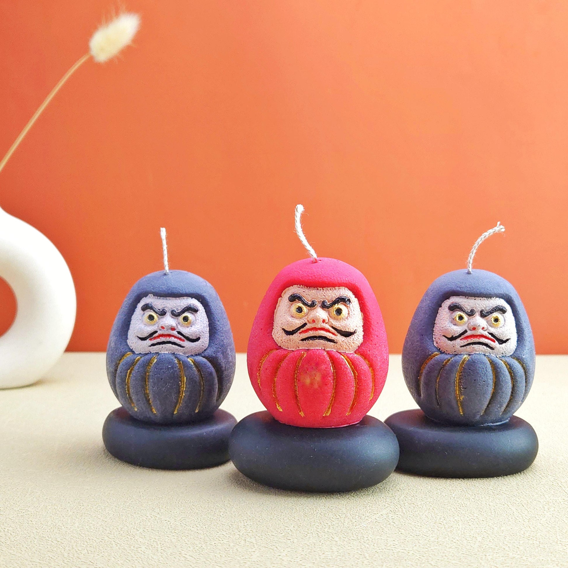 daruma doll, daruma candle, handmade candle, soy wax candle, pillar wax, good fortune candles, unique candle, lucky charm gifts, scented candle, cute candle, Japanese-style home decor, home decor, positive energy candles, inspirational gift ideals