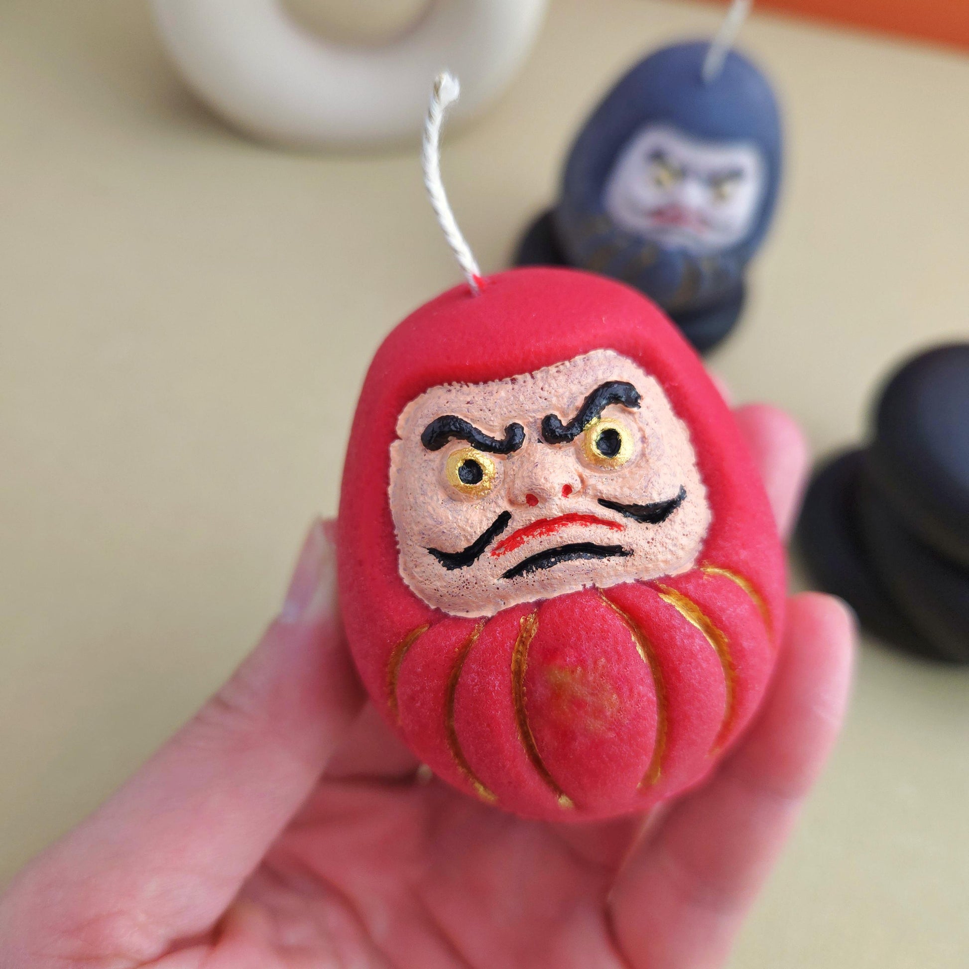 daruma doll, daruma candle, handmade candle, soy wax candle, pillar wax, good fortune candles, unique candle, lucky charm gifts, scented candle, cute candle, Japanese-style home decor, home decor, positive energy candles, inspirational gift ideals