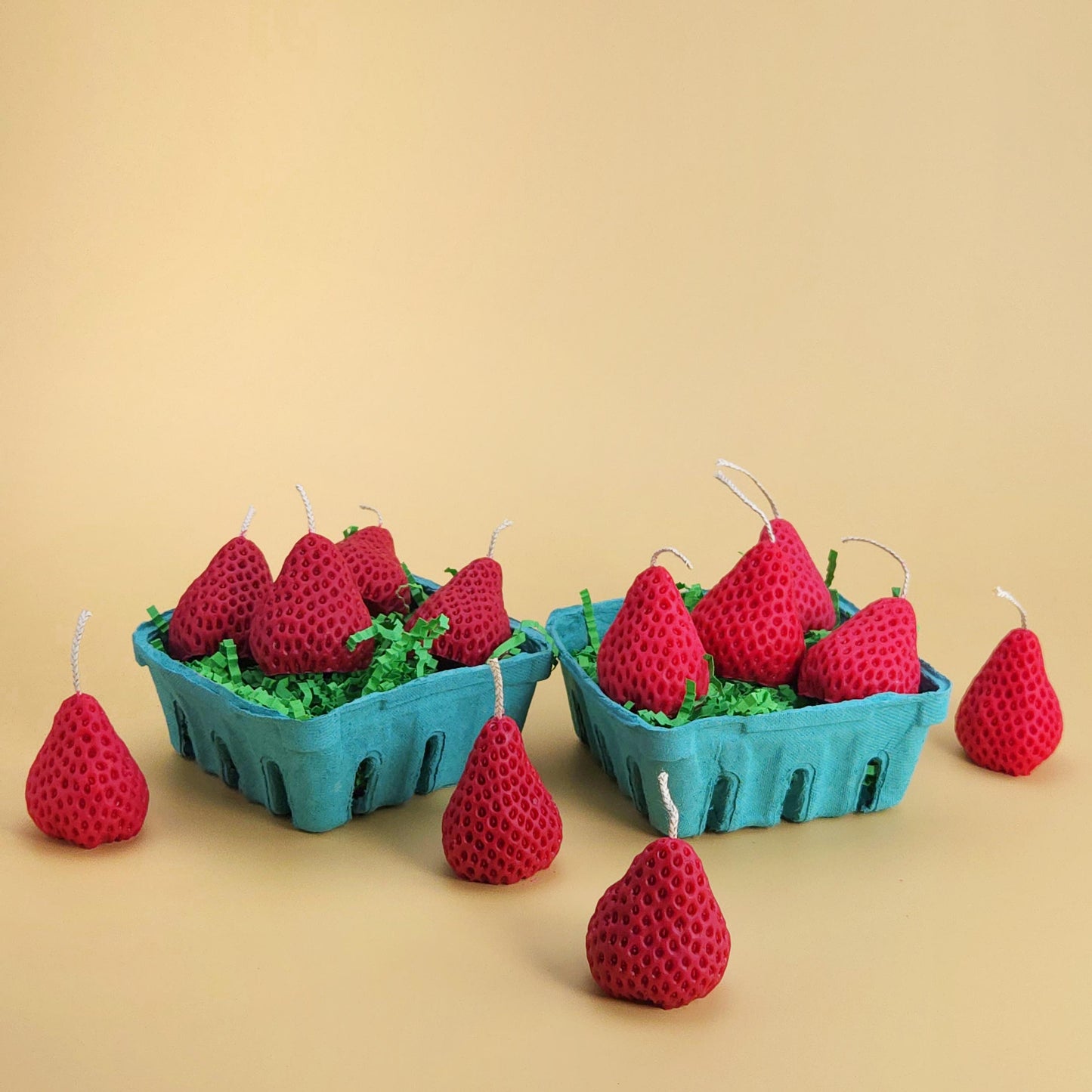 two realistic basket of strawberry candles, strawberry set candle, blue pulp basket of strawberries, red strawberry with wick on yellow background, green crinkle cut paper inside, gift of cake topper, birthday strawberry topper, berry with holes, looks like real strawberry, birthday candles, home decor, kitchen decor candles, giving off a sweet strawberry scent, juicy strawberry, strawberry-shaped soy candles