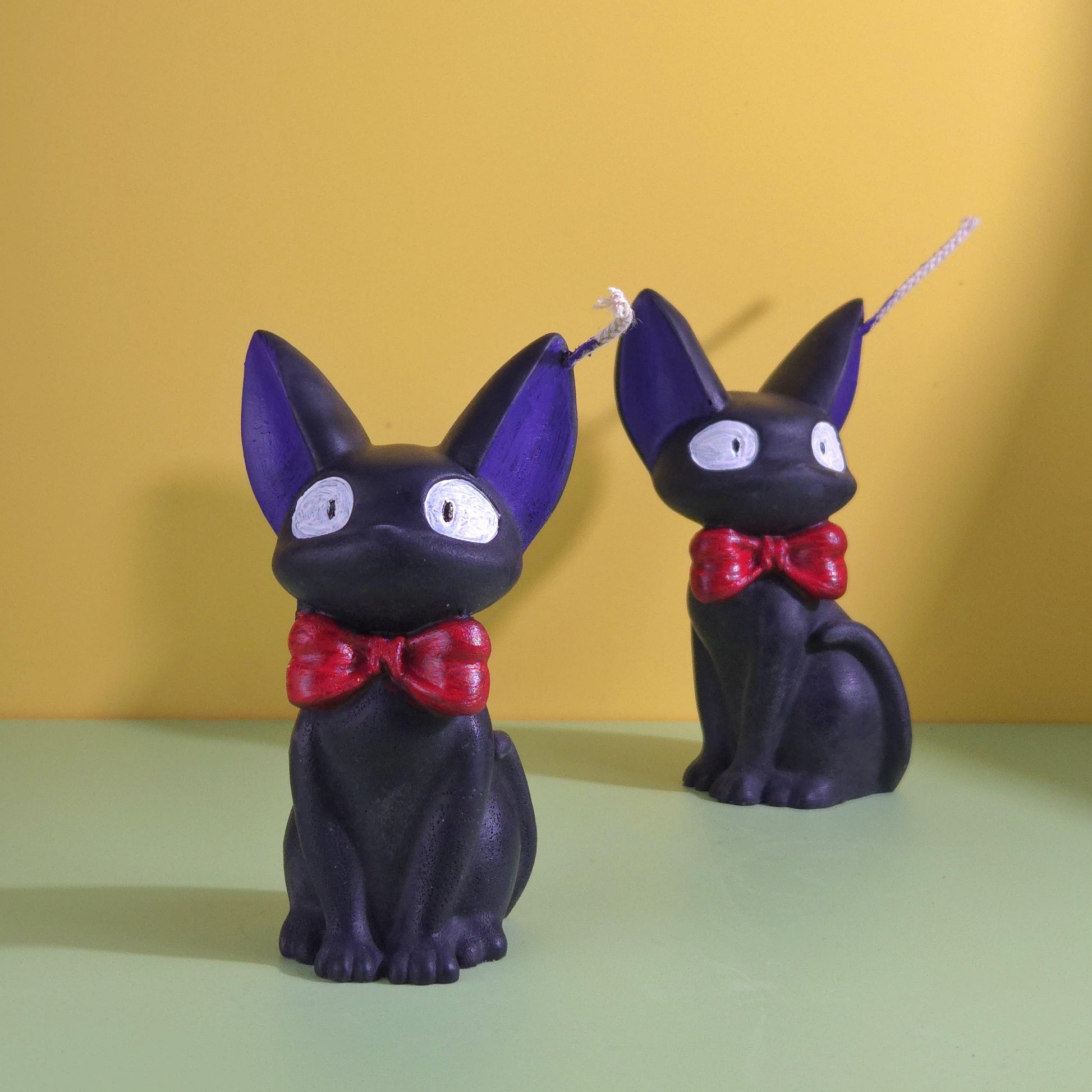 Hand-poured soy wax Jiji black cat candle with red bow tie, inspired by Kiki’s Delivery Service, Studio Ghibli gift for anime and cat lovers, 2.5x3.5 inches.