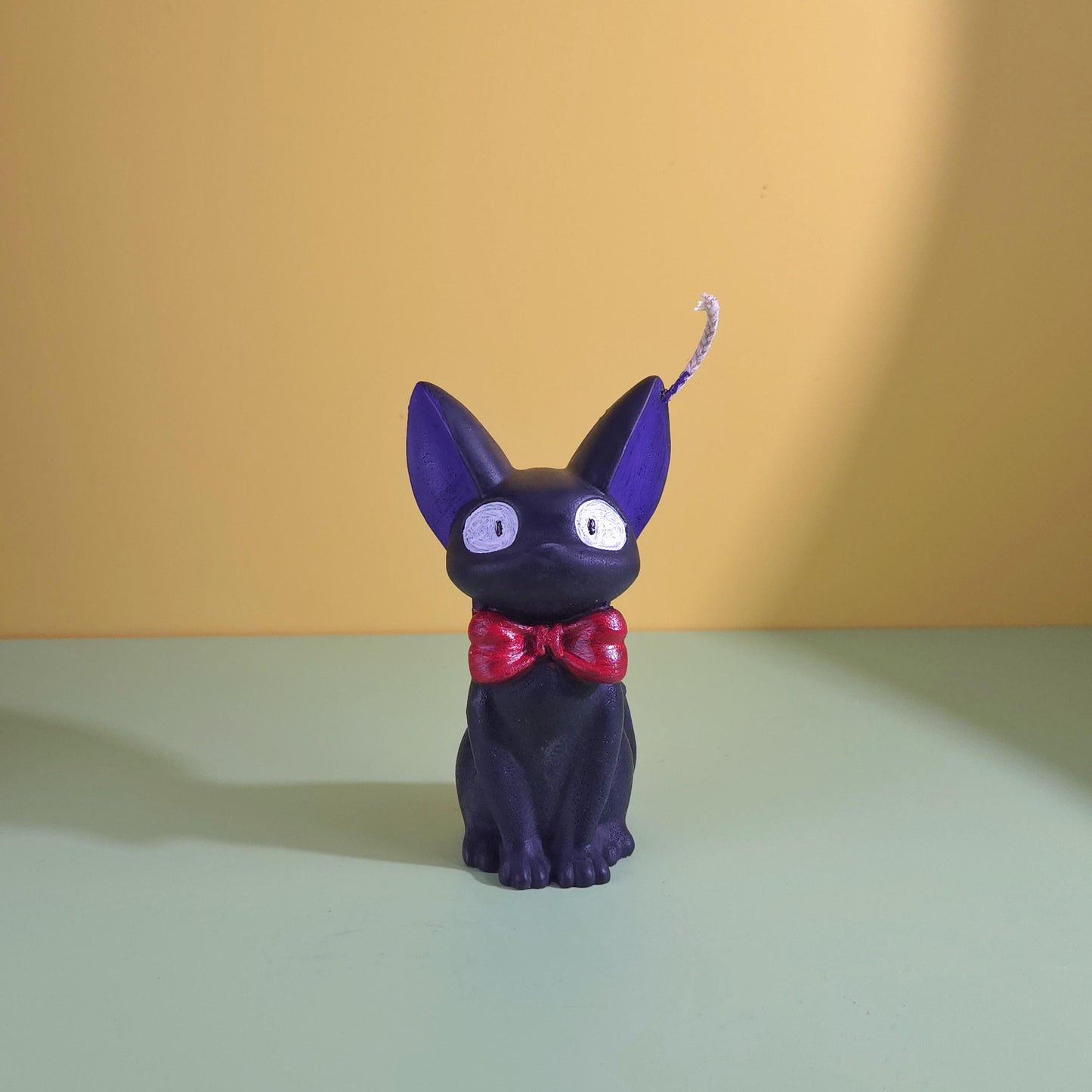 Hand-poured soy wax Jiji black cat candle with red bow tie, inspired by Kiki’s Delivery Service, Studio Ghibli gift for anime and cat lovers, 2.5x3.5 inches.