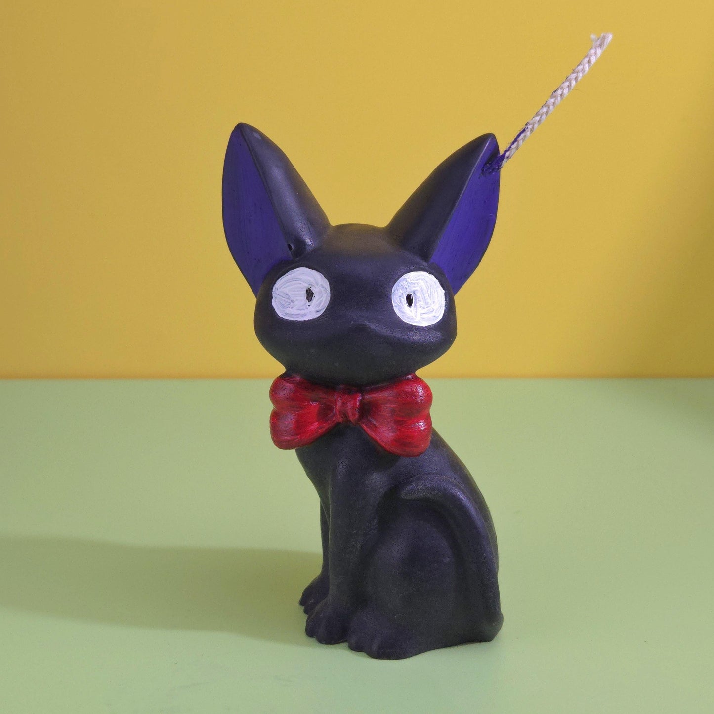 Hand-poured soy wax Jiji black cat candle with red bow tie, inspired by Kiki’s Delivery Service, Studio Ghibli gift for anime and cat lovers, 2.5x3.5 inches.