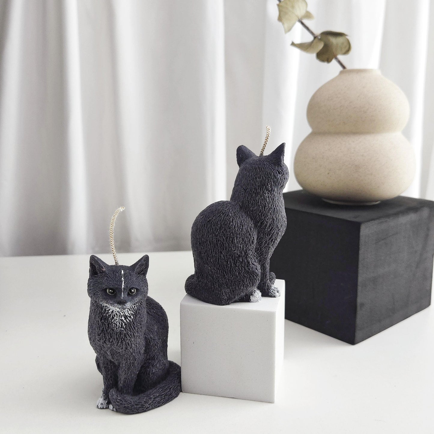 Decorative black cat candle styled on a shelf as a cat lover home decor accent