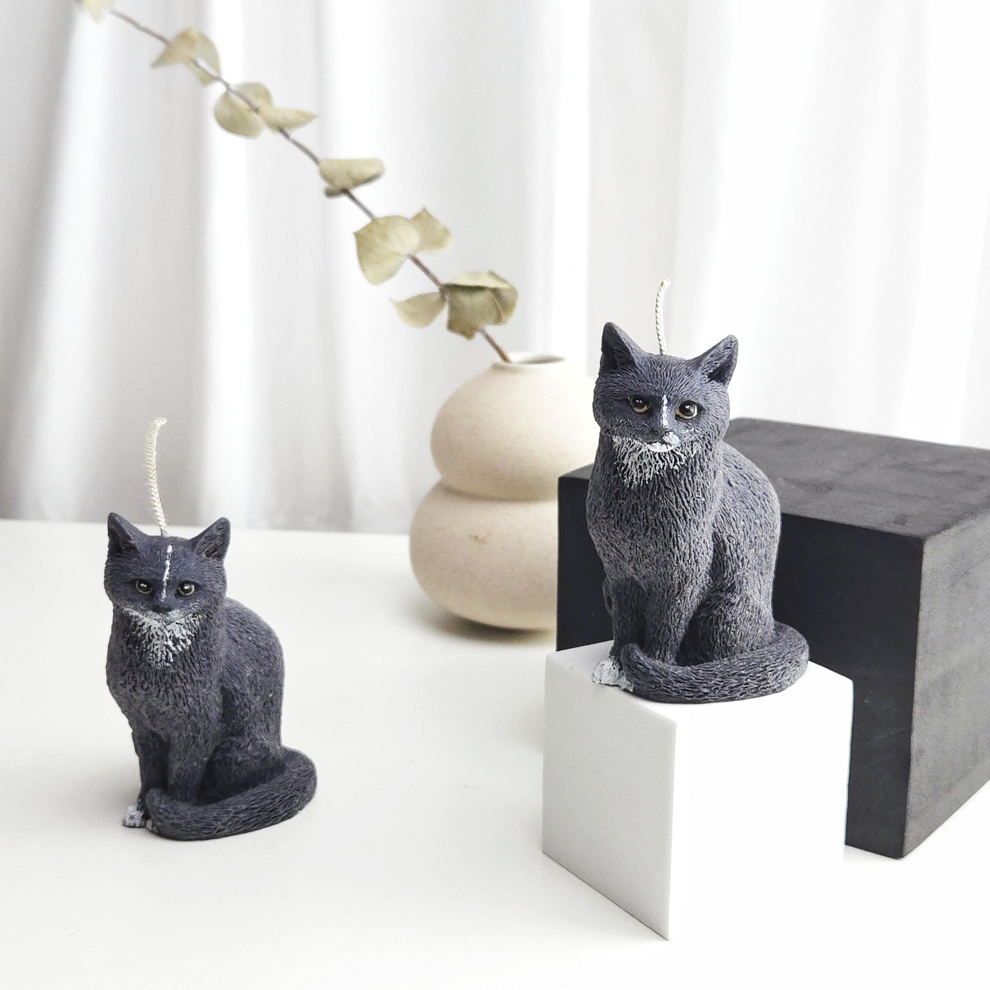 Small black cat candle measuring approximately 3.5 inches tall displayed for size reference