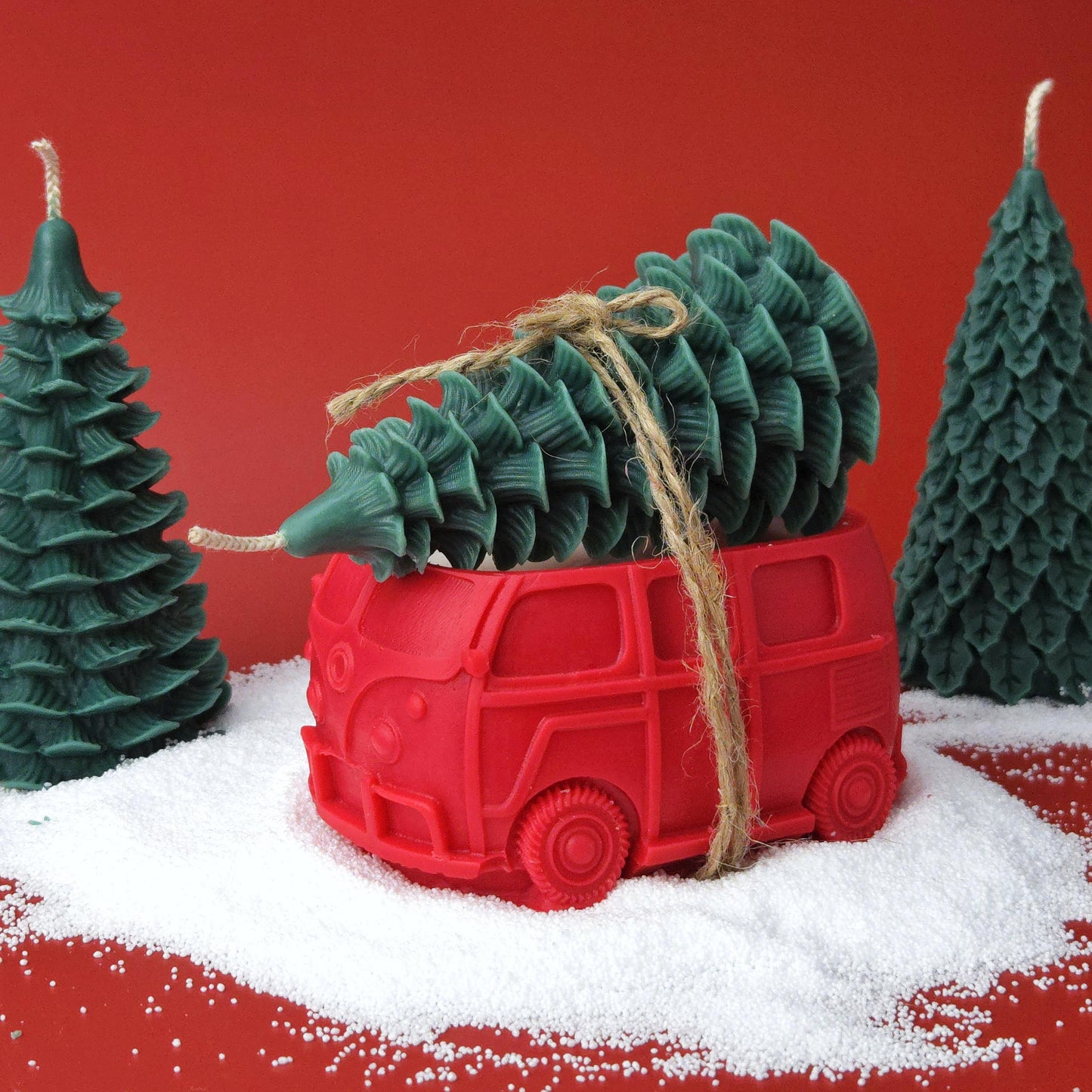 Red vintage car candle carrying a green Christmas tree candle, handmade soy wax holiday decoration.